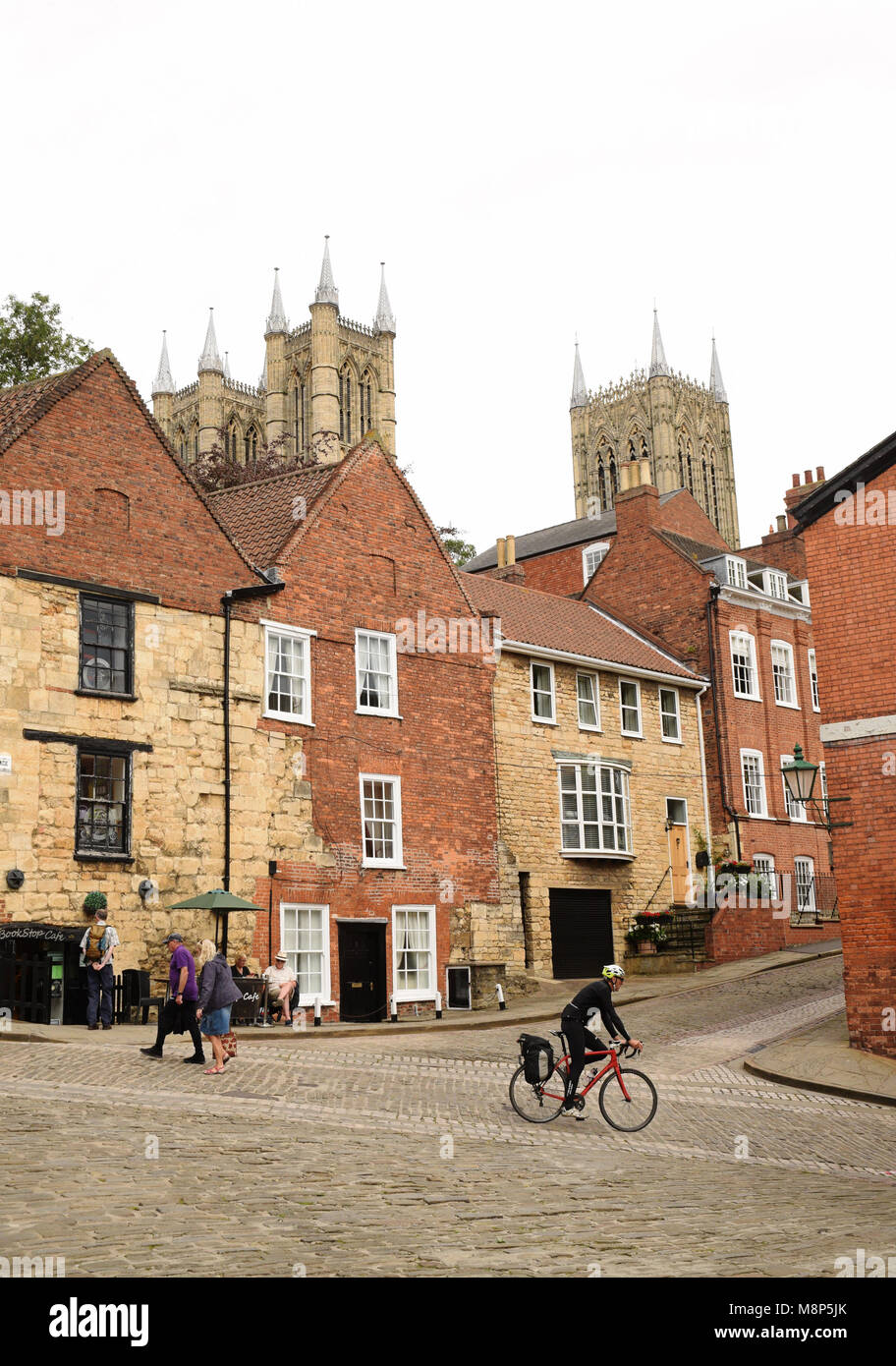 Lincoln, Steep Hill and Christs Hospital Terrace intersection; with the Cathedral West Towers and massive central tower viewed to the rear Stock Photo