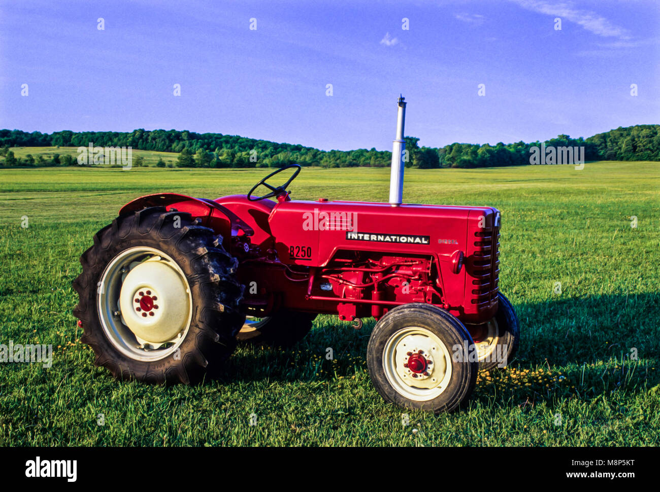 Vintage red international tractor, New York, USA. FS 10.64 MB, vintage tractors antique images NY farmland farm land Stock Photo
