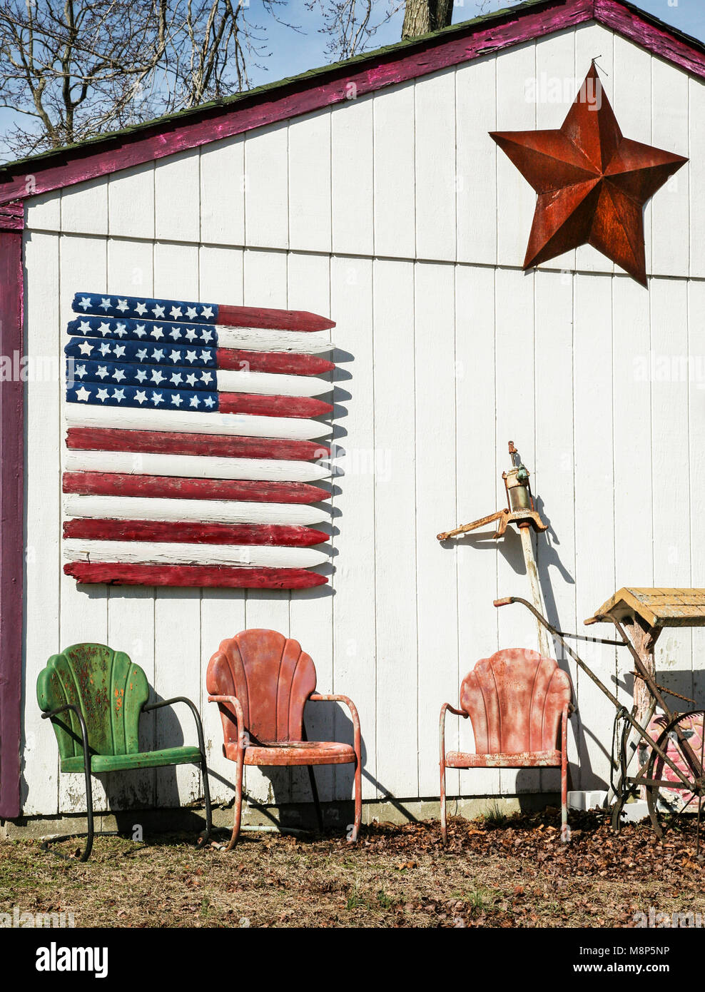 Wooden Flag and vintage metal chairs, vintage garden furniture, near Hammonton, New Jersey, USA, farm building vertical farming tool shed Stock Photo