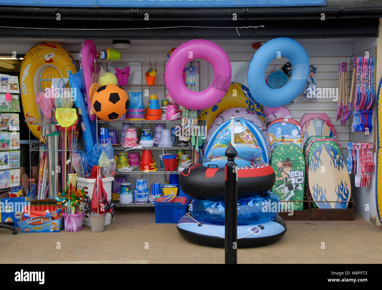Beach shop full of children's plastic inflatables, buckets, spades