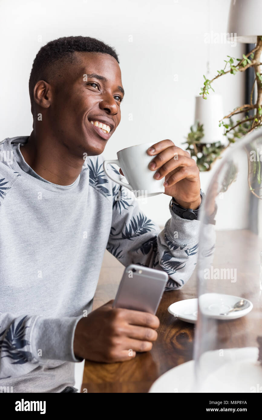 Pretoria, South Africa - Jan 8,2018: African man at a coffee shop. Stock Photo