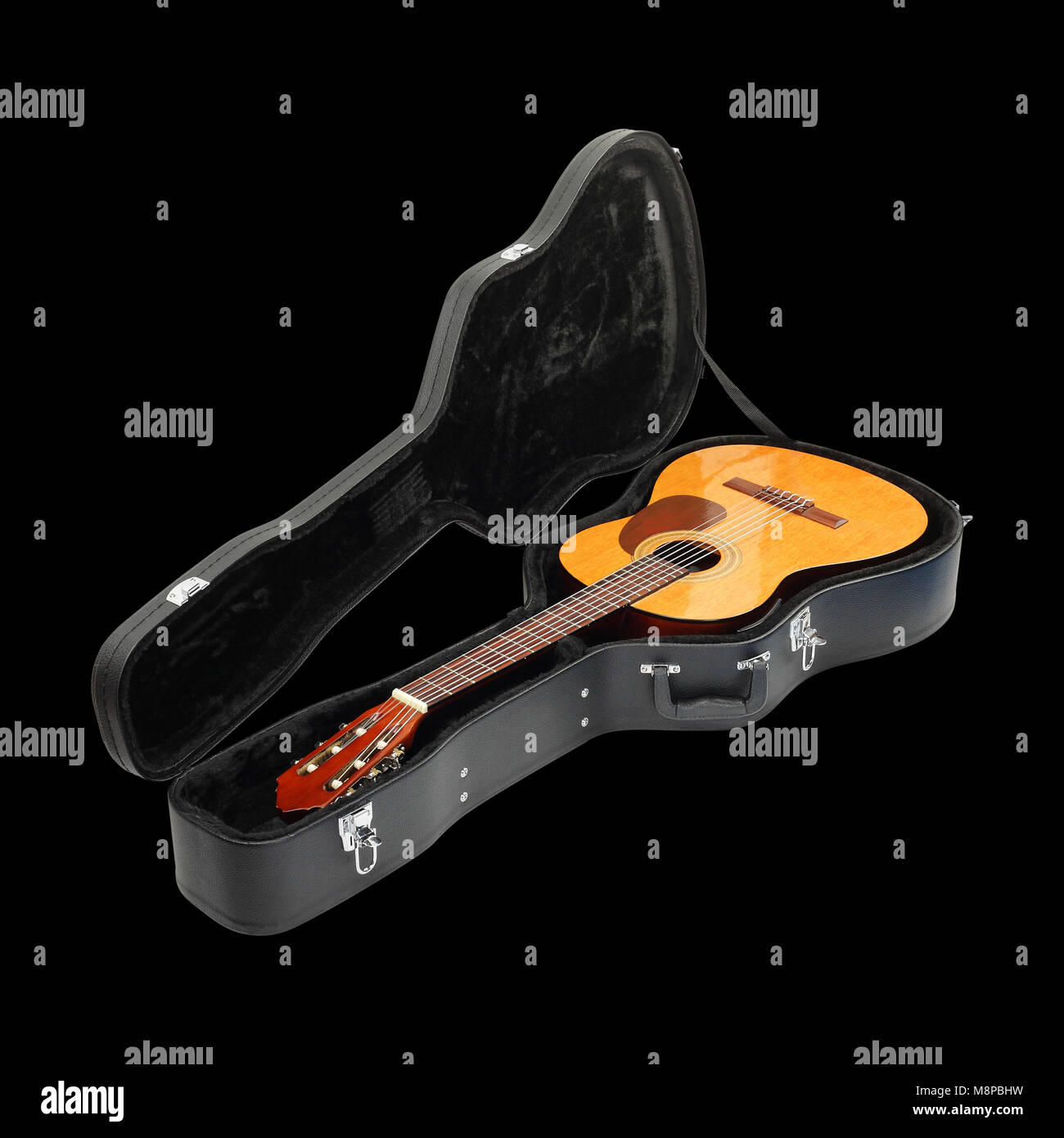 Musical instrument - Classic guitar hard case isolated on a black background. Stock Photo