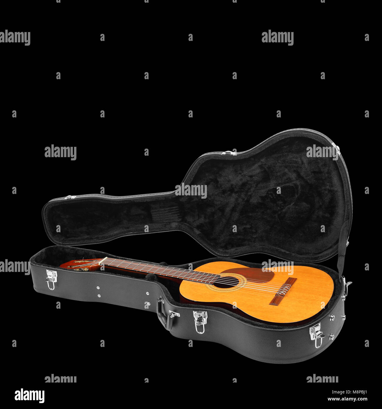Musical instrument - Classic guitar hard case isolated on a black background. Stock Photo