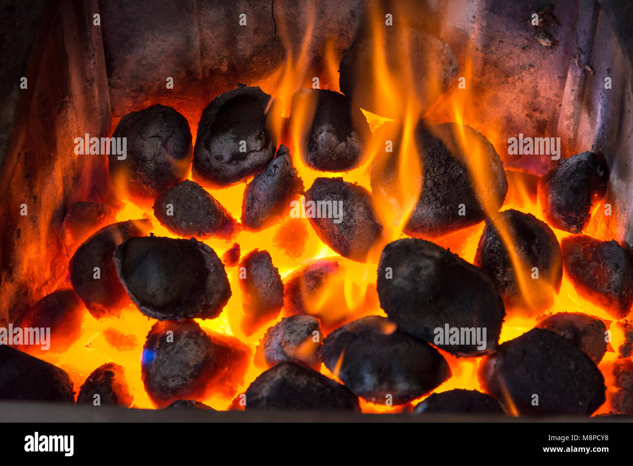 Warm coals buring in an open fire Stock Photo Alamy