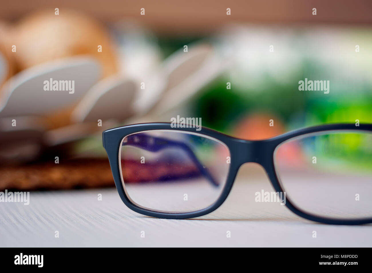 a pair of eyeglasses on a white plane Stock Photo Alamy