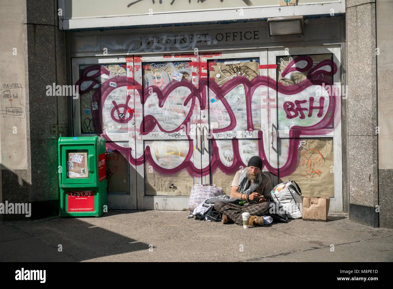 A homeless individual encamped on the sidewalk in New York on Saturday, March 17, 2018. (© Richard B. Levine) Stock Photo