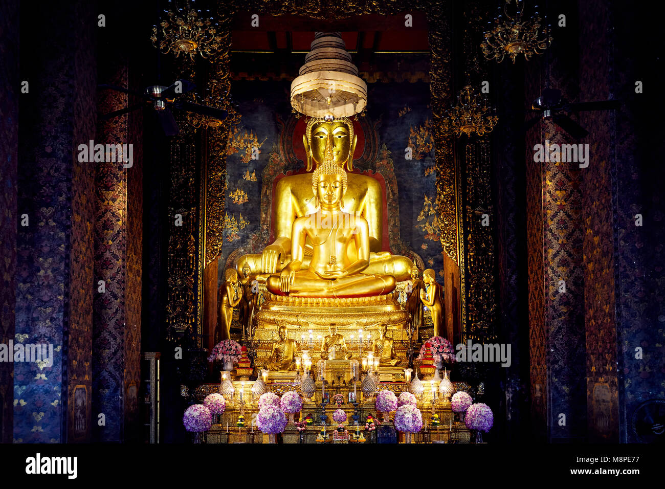 Golden Buddha statue in the hall of temple in Bangkok, Thailand Stock ...