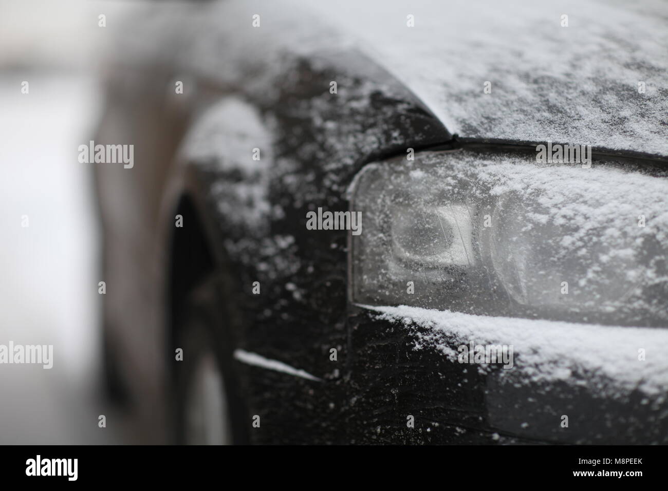 fragment of the car, front view, snow ice Stock Photo