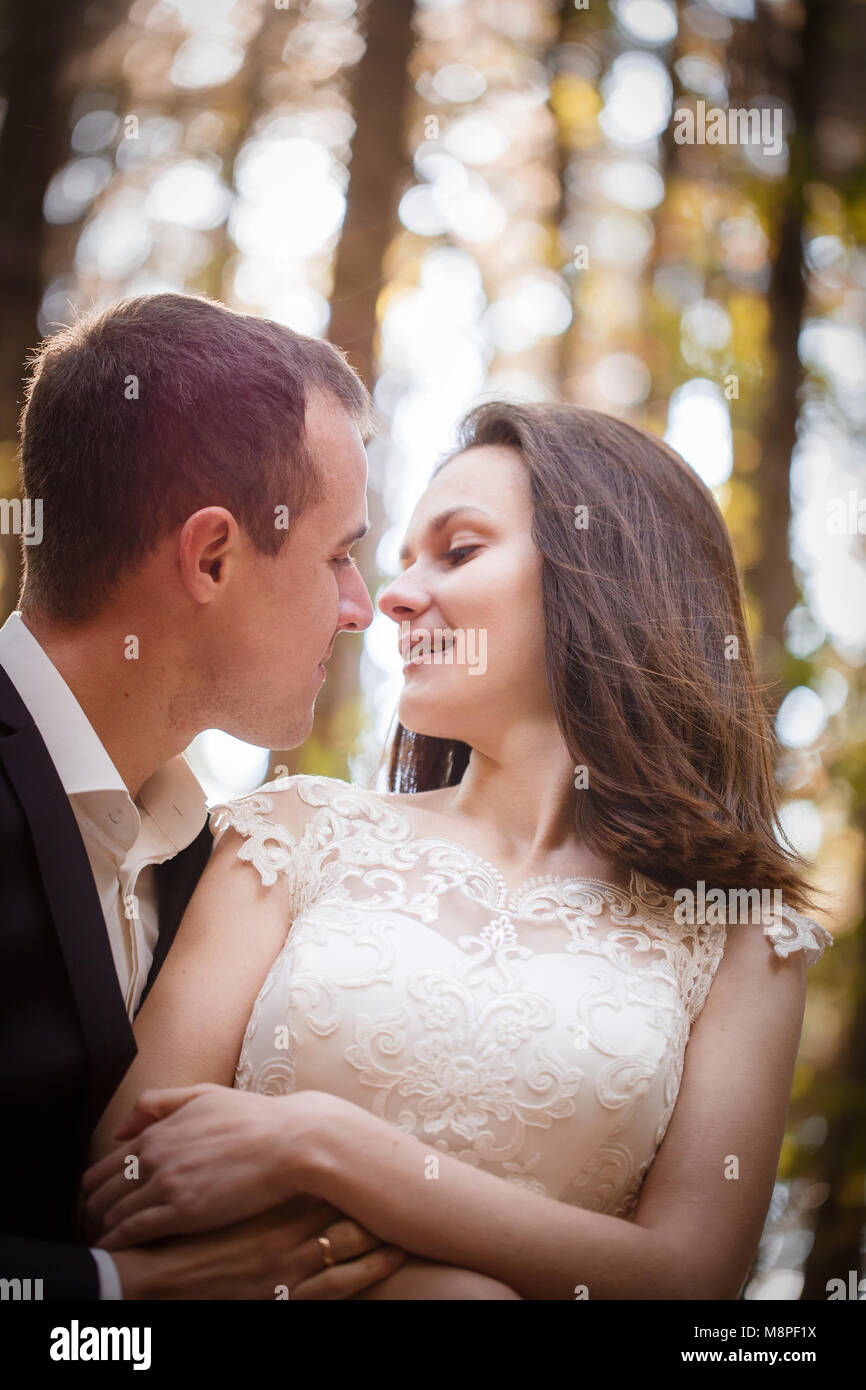 Beautiful couple in love on a walk in autumn forest Stock Photo - Alamy
