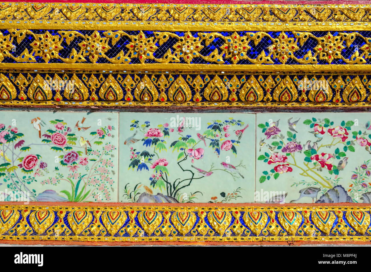 Artfully detailed porcelain tiles and golden shelves are decorating