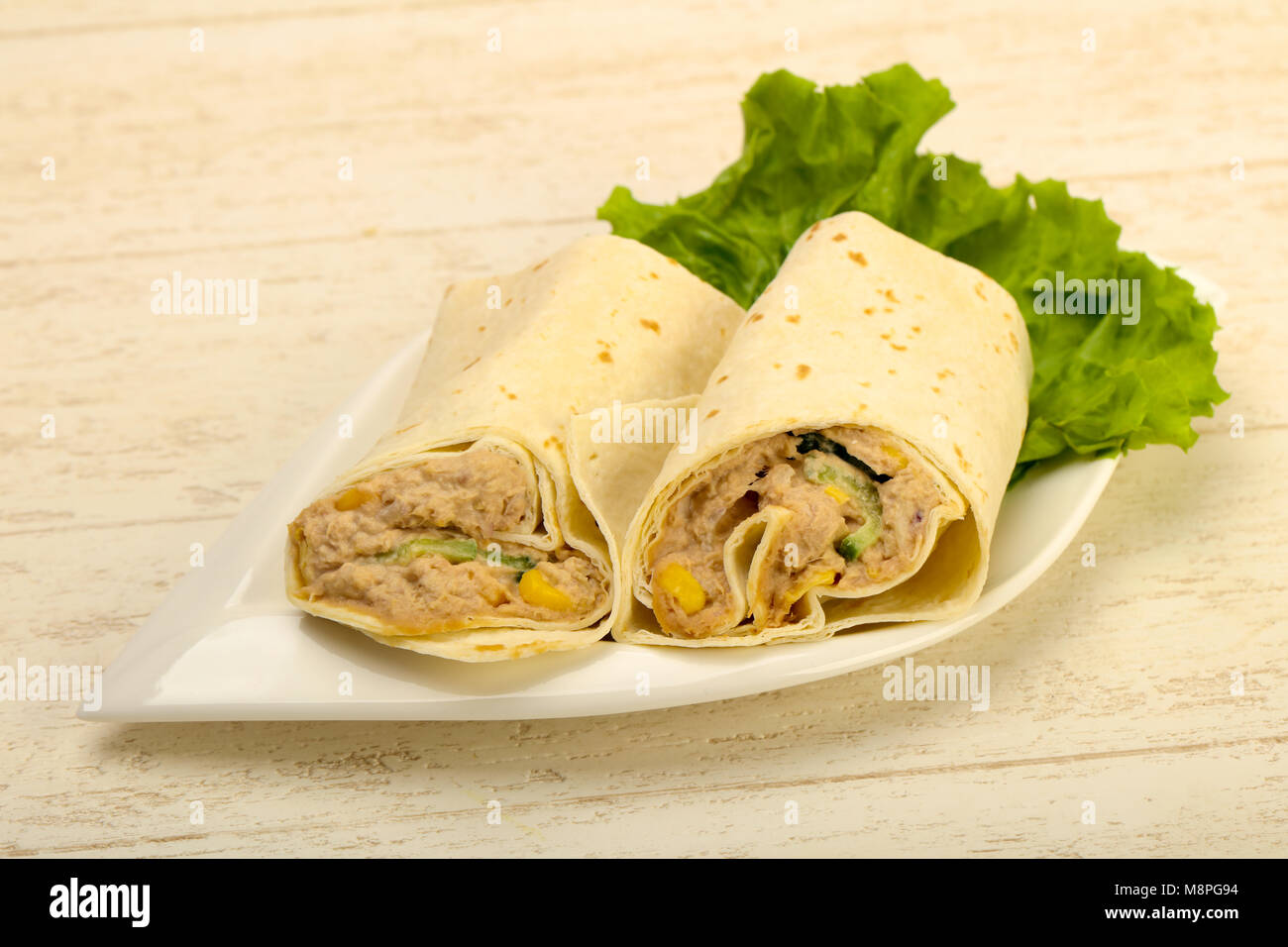 Tuna bread roll with salad leaves Stock Photo - Alamy