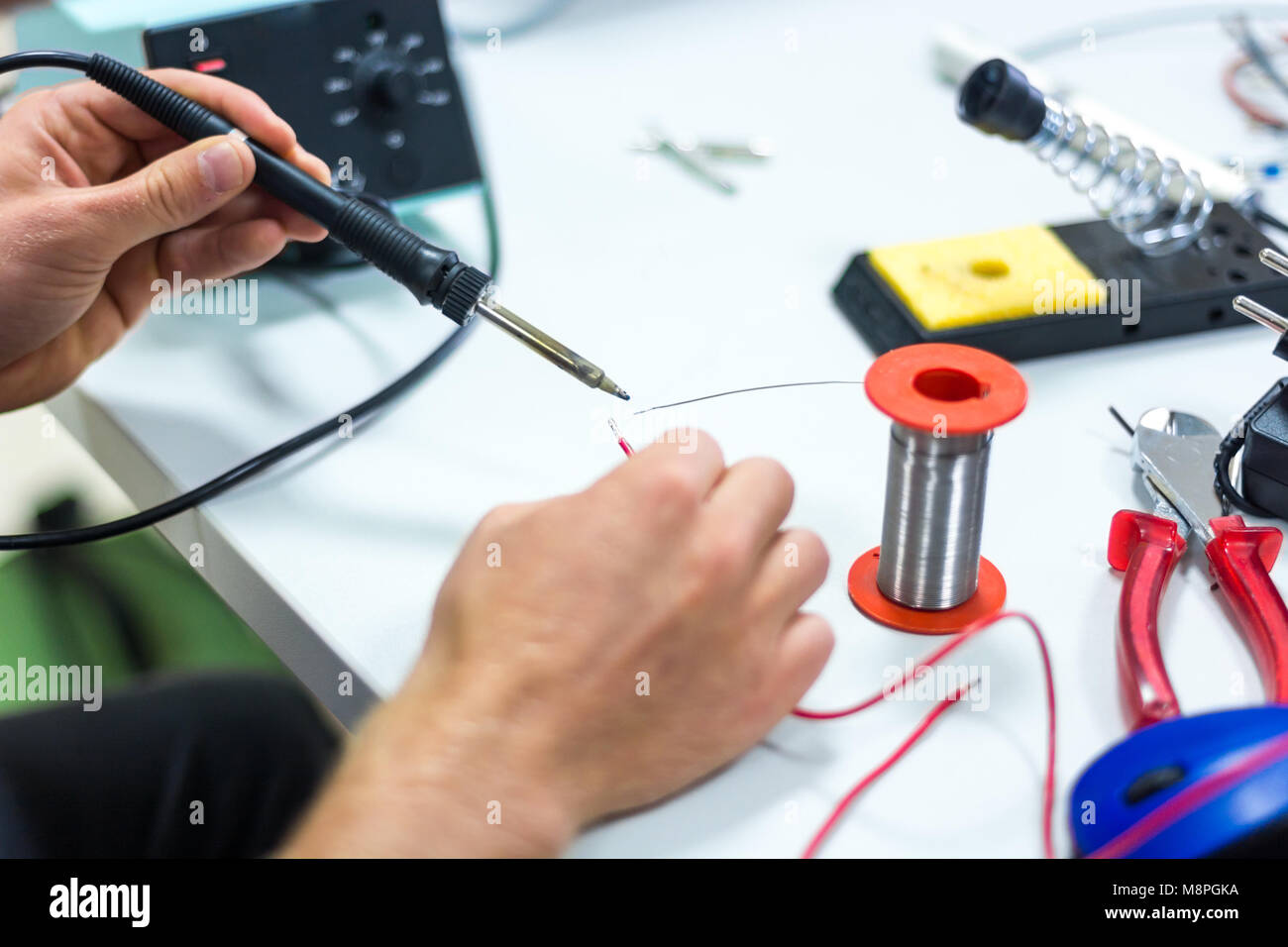 Electrician soldering wires Stock Photo Alamy