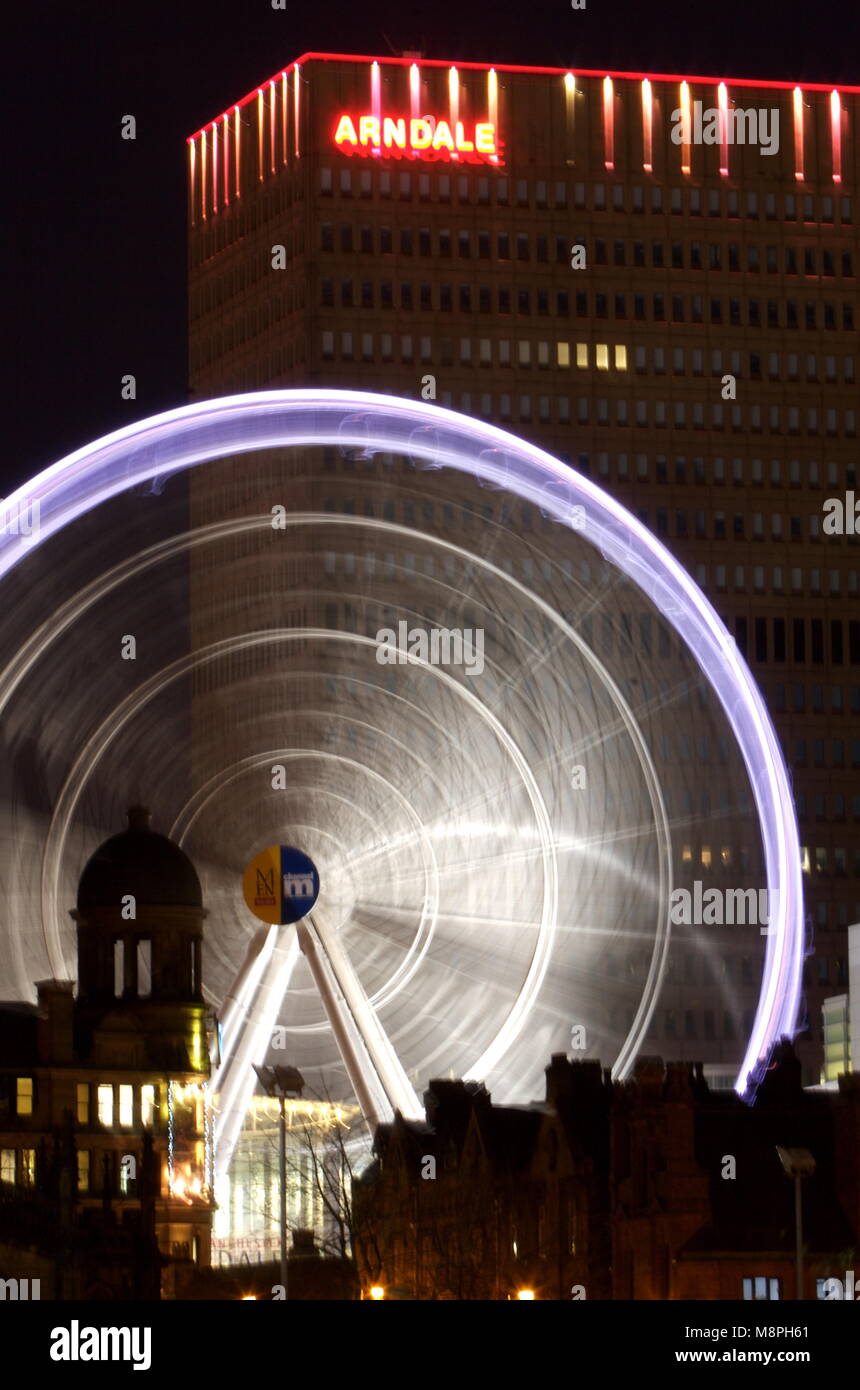 Twilight shot of Manchester Arndale with ferris wheel Stock Photo