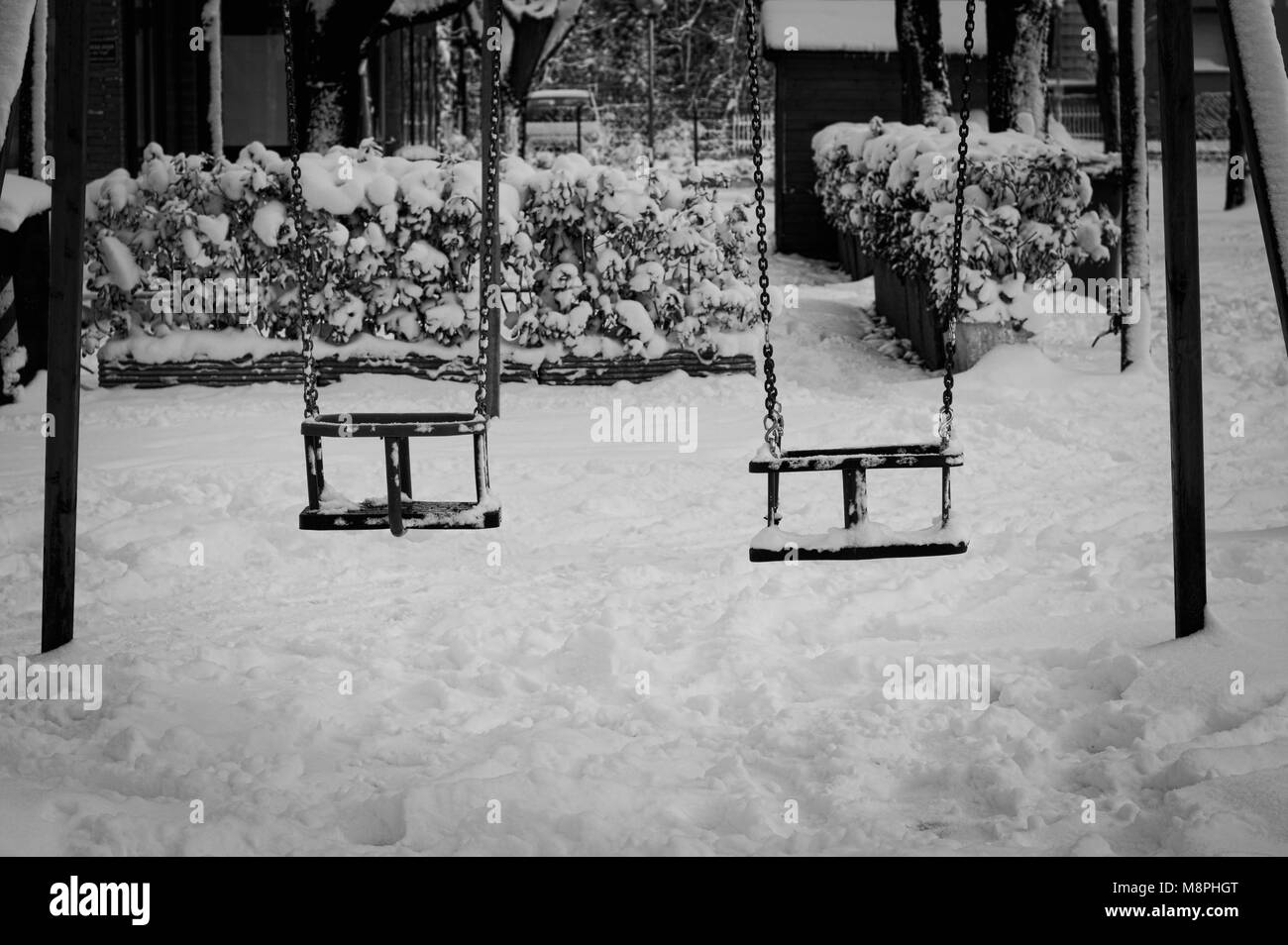 Black and white seesaw on the snow (Pesaro, Italy) Stock Photo
