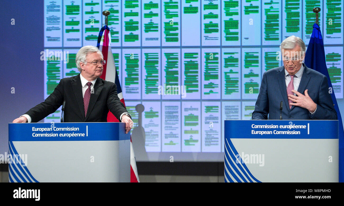 Brussels, Belgium. 19th Mar, 2018. United Kingdom's Secretary of State for Exiting the European Union, David Davis (L) and Michel Barnier, the European Chief Negotiator of the Task Force for the Preparation and Conduct of the Negotiations with the United Kingdom under Article 50, at the background display showing draft of Negotiation agreement, during press conference on Brexit negotiations at European Commission headquarters in Brussels, Belgium on 19.03.2018 by Wiktor Dabkowski | usage worldwide Credit: dpa/Alamy Live News Stock Photo