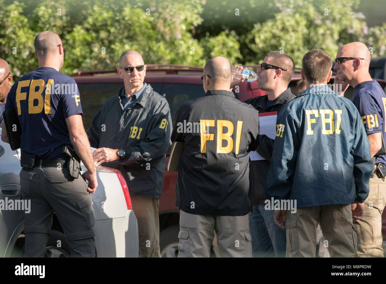 fbi-agents-work-at-the-scene-of-a-fourth-package-bombing-in-three-M8PRDW.jpg