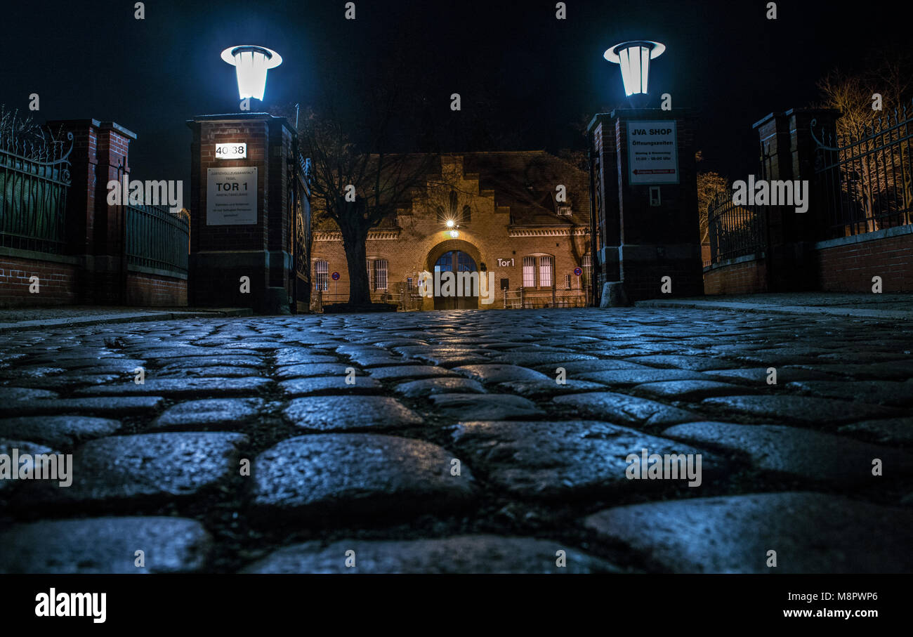 15 March 2018, Germany, Berlin: The main entrance of Tegel prison is illuminated in the evening. (taken with long time exposure) Photo: Paul Zinken/dpa Stock Photo