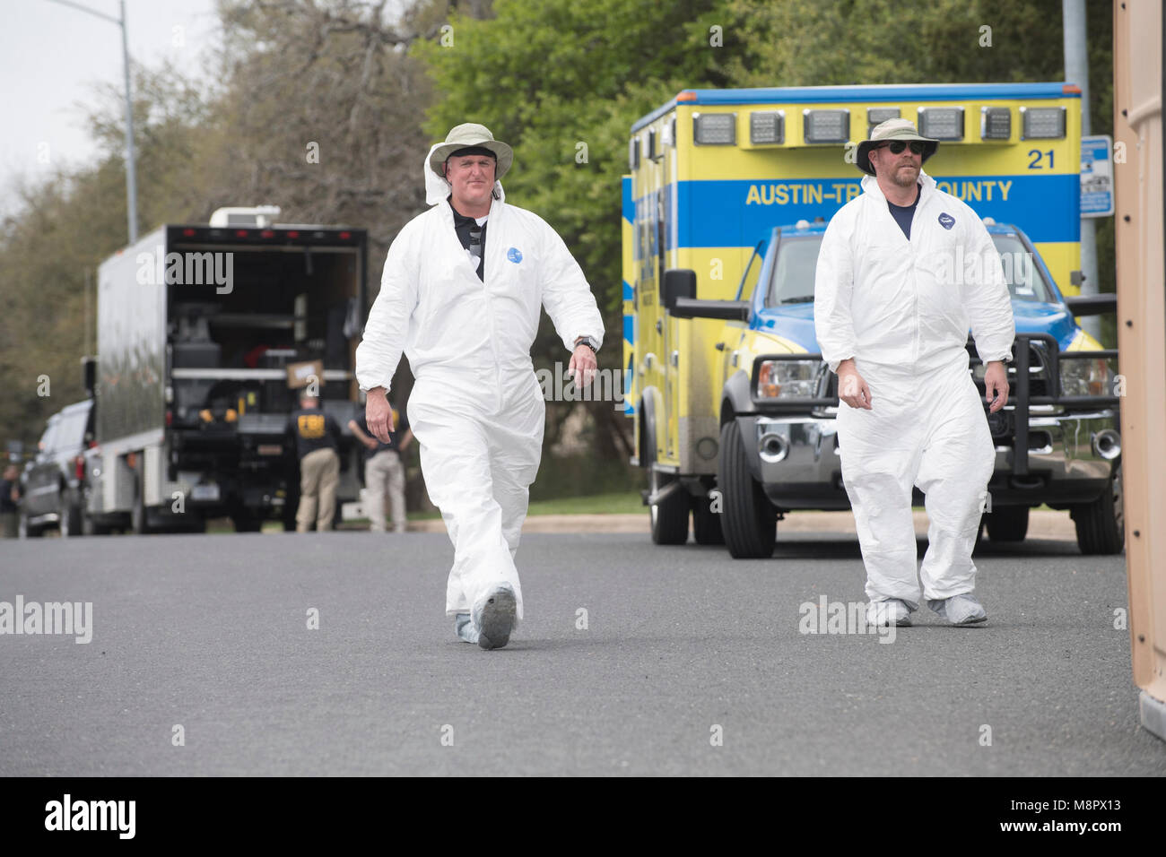 ATF and FBI agents work into the afternoon as a fourth package bomb  exploded on a southwest Austin roadside injuring two men. Stock Photo
