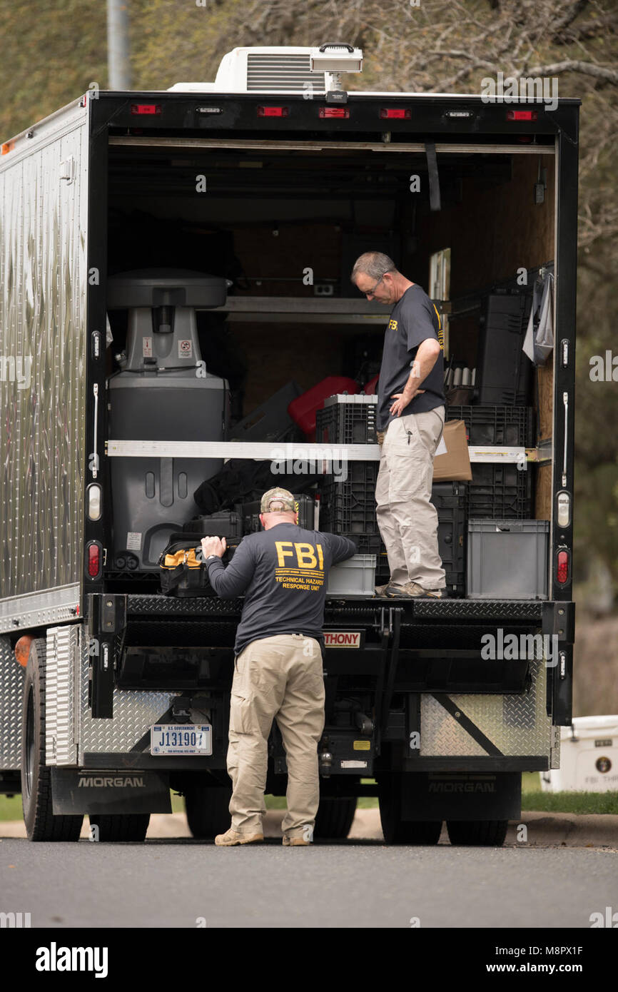 FBI agents work into the afternoon as a fourth package bomb  exploded on a southwest Austin roadside injuring two men. Stock Photo