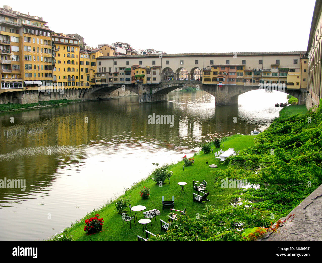 Ponte Vecchio old building and bridge over river Arno Florence Stock Photo