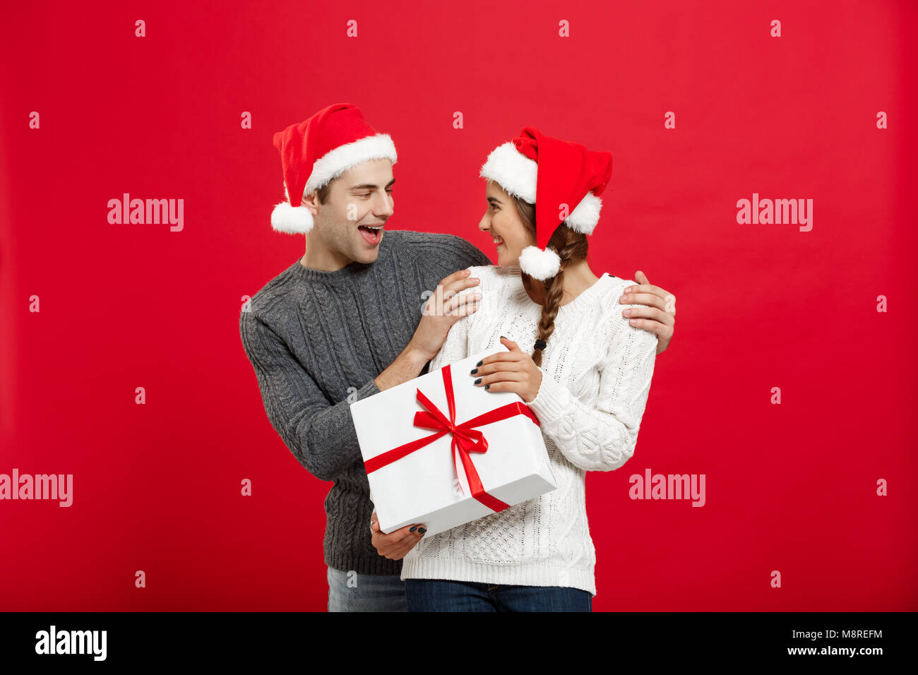 Man Covering Eyes Of Woman With His Hand Surprise Hi Res Stock