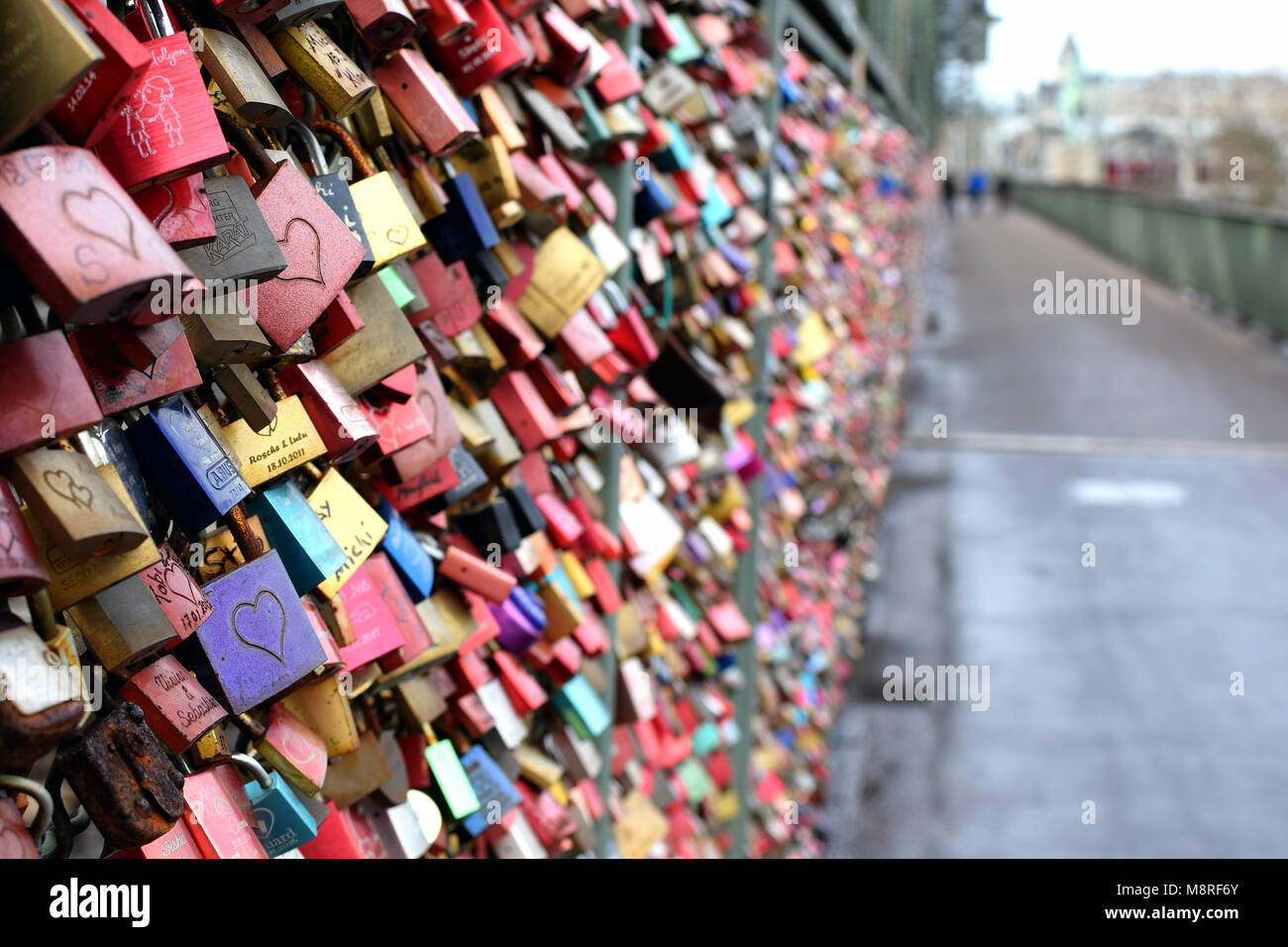 COLOGNE, GERMANY - March 5 2018: Love padlocks on the fence of Hohenzollern railway bridge. Stock Photo