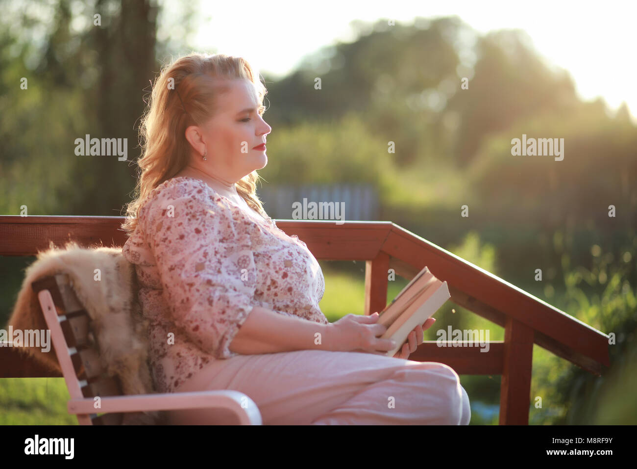 An elderly woman on the porch of a house Stock Photo - Alamy