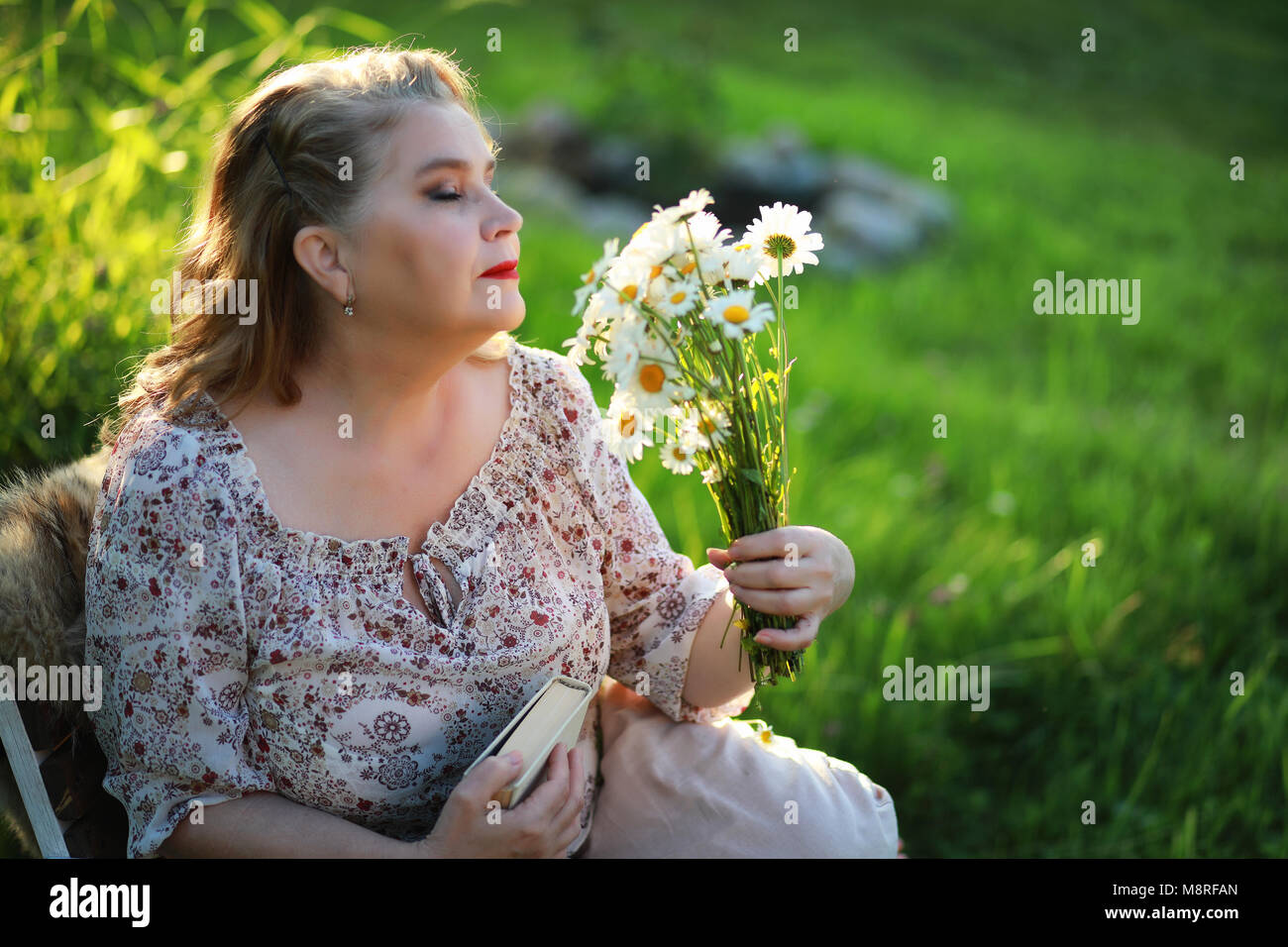 An elderly woman on the porch of a house Stock Photo - Alamy