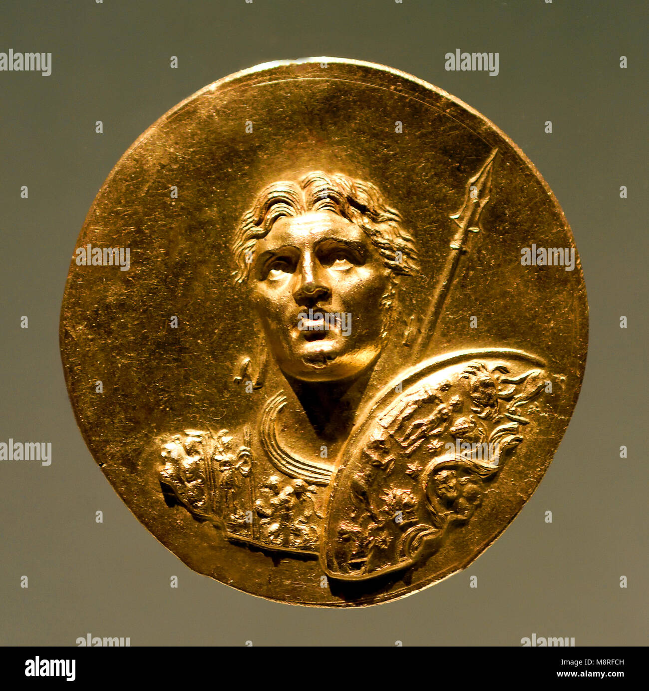 Alexander the Great was an ancient king of Macedon (356–323 BC). Greek, Greece ( Cuirassed bust of Alexander wearing a diadem with round Shield ) Stock Photo