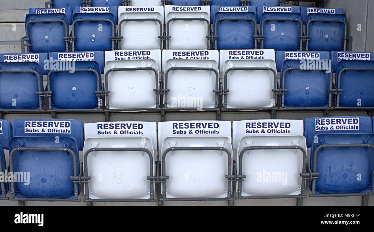 empty reserved stadium seats making patterns in blue and white before a match in castletownshend, west cork, ireland. Stock Photo