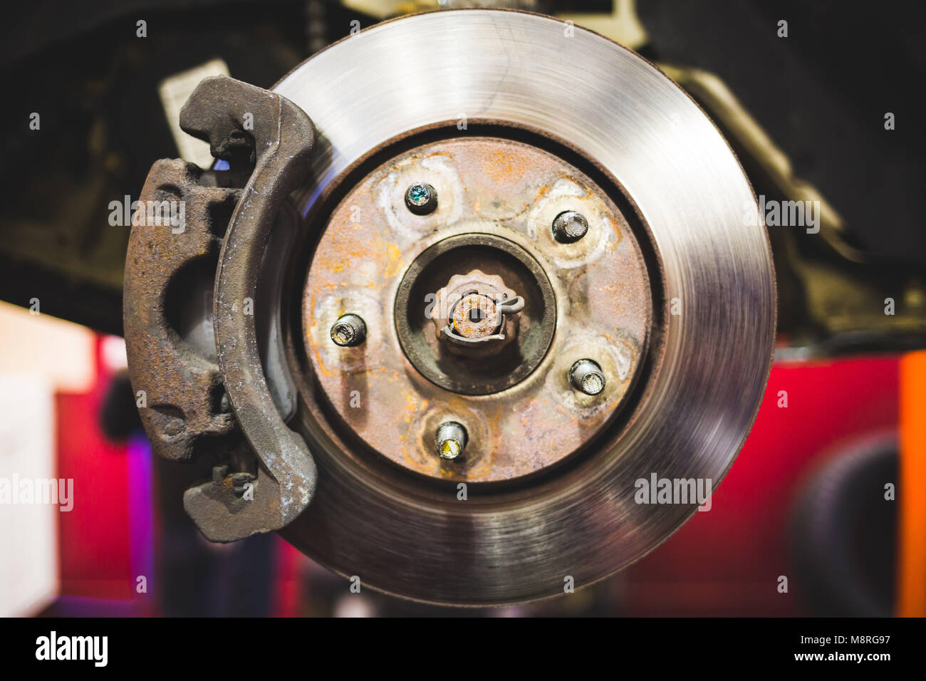Car disk brakes repair service performed maintenance Stock Photo