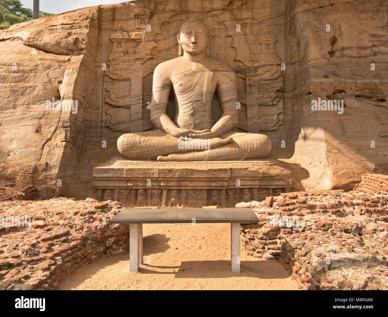 The Sitting Buddha at Gal Vihara in Polonnaruwa, Sri Lanka on a sunny day with blue sky. Stock Photo