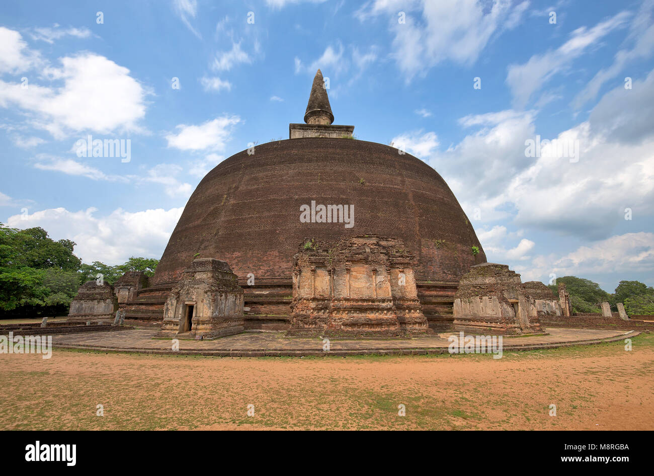 A view of Rankot Vihara at Polonnaruwa in Sri Lanka on a sunny day with blue sky. Stock Photo