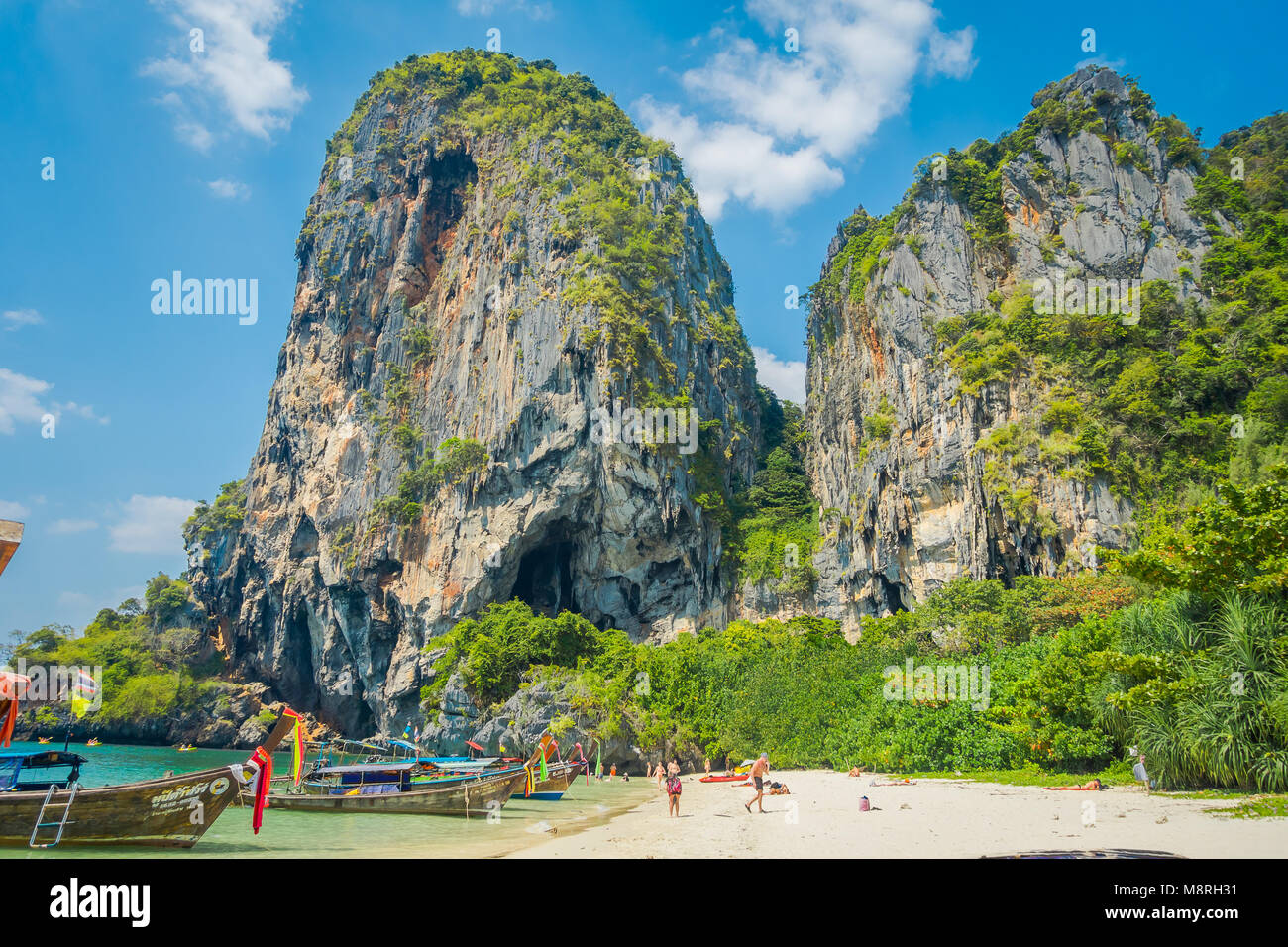 PHRA NANG, THAILAND - FEBRUARY 09, 2018: Outdoor view of unidentified people enjoying the beautiful sunny day, white sand and turquoise water on Phra nang island Stock Photo
