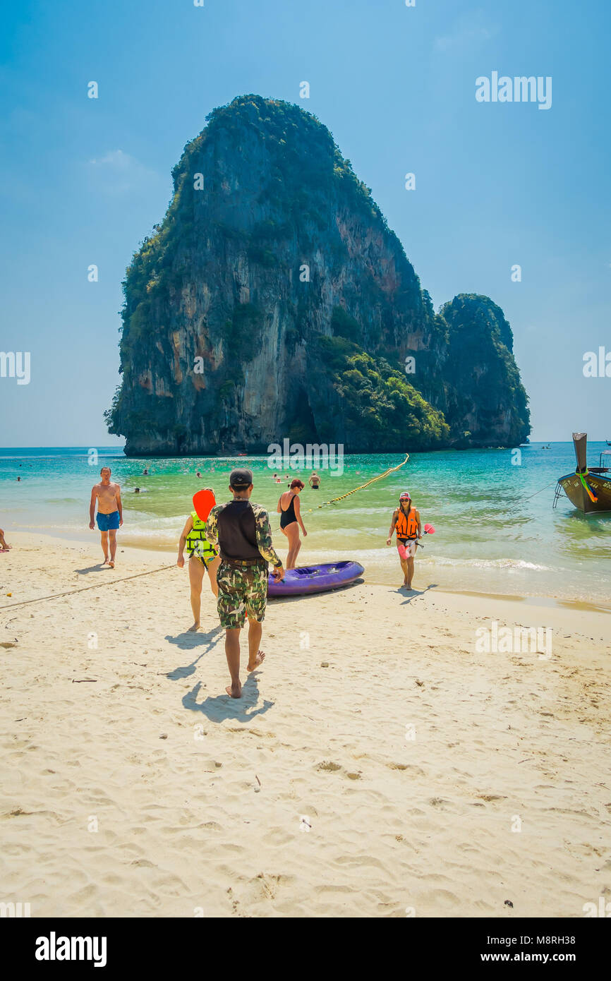 PHRA NANG, THAILAND - FEBRUARY 09, 2018: Outdoor view of unidentified people enjoying the beautiful sunny day, white sand and turquoise water on Phra nang island Stock Photo