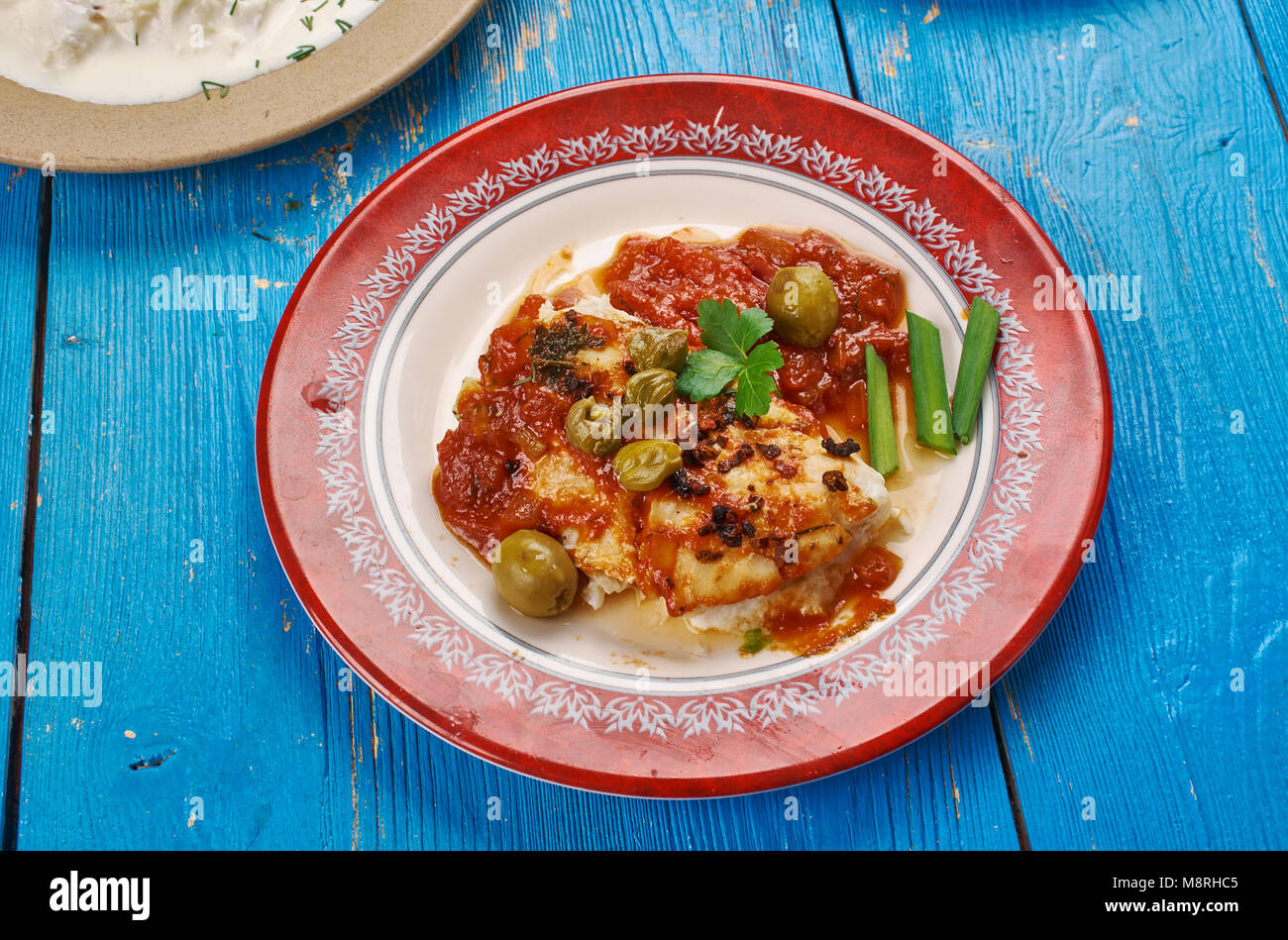 Baccala alla Vesuviana - Salt Cod in a Tomato Sauce, close up Stock Photo