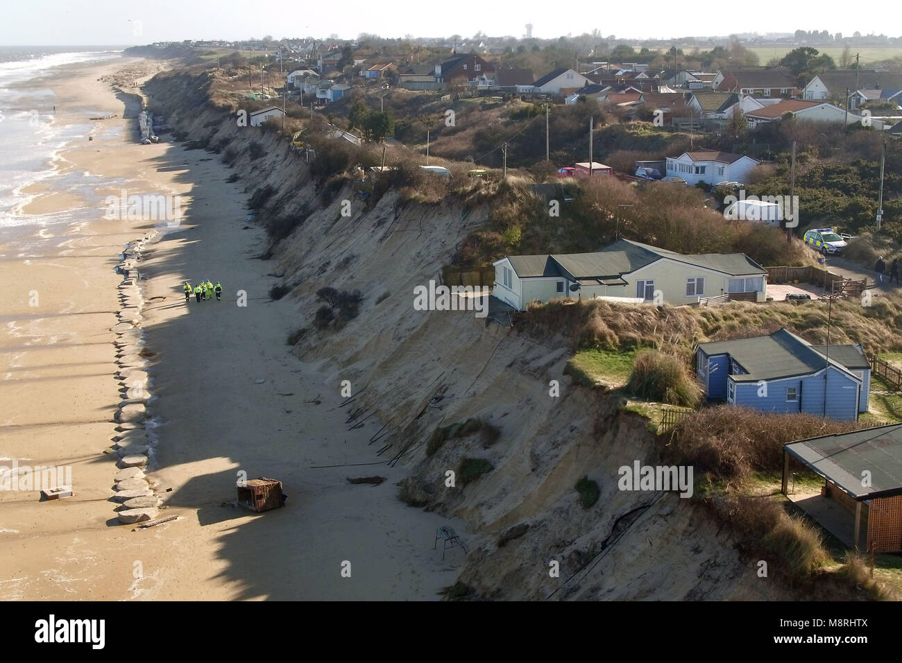 Houses sit on the cliff edge on The Marrams in Hemsby, Norfolk where