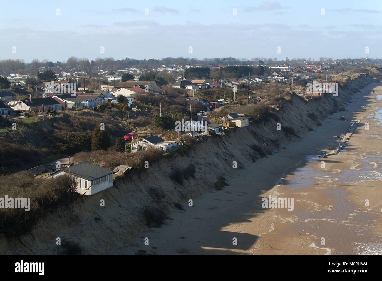 Houses sit on the cliff edge on The Marrams in Hemsby, Norfolk where