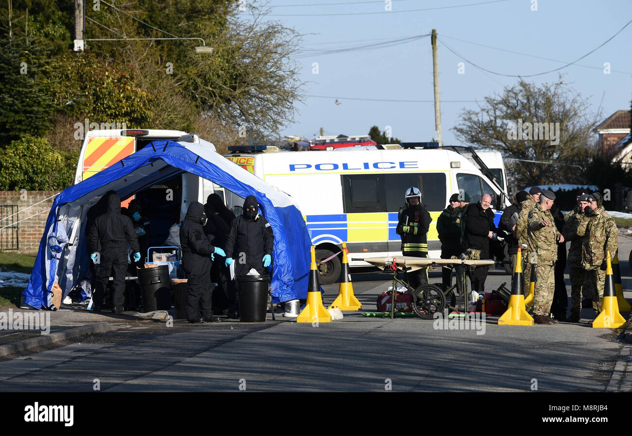 Police, Army and Emergency service personal on Larkhill Road in Durrington, Salisbury, as they wait for a vehicle of interest to be taken away, as the investigation into the suspected nerve agent attack on Russian double agent Sergei Skripal and his daughter Yulia continues. Stock Photo