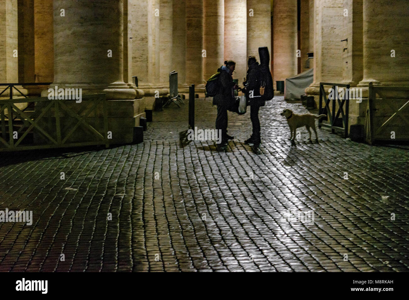 ROME, ITALY, JANUARY - 2018 - Urban night rainy scene with cobblestone street road as main subjet, Rome city, Italy Stock Photo