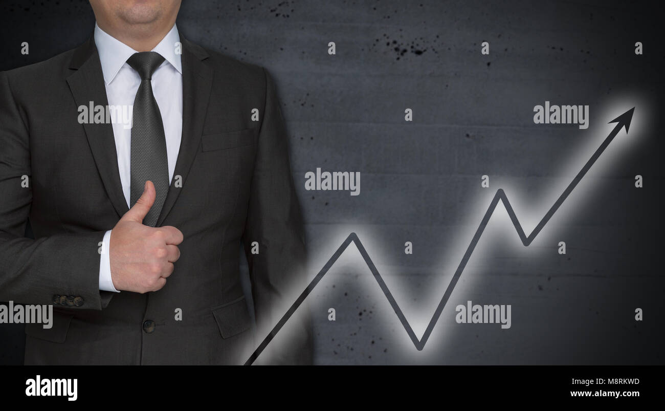 Graph concept and businessman with thumbs up Stock Photo - Alamy