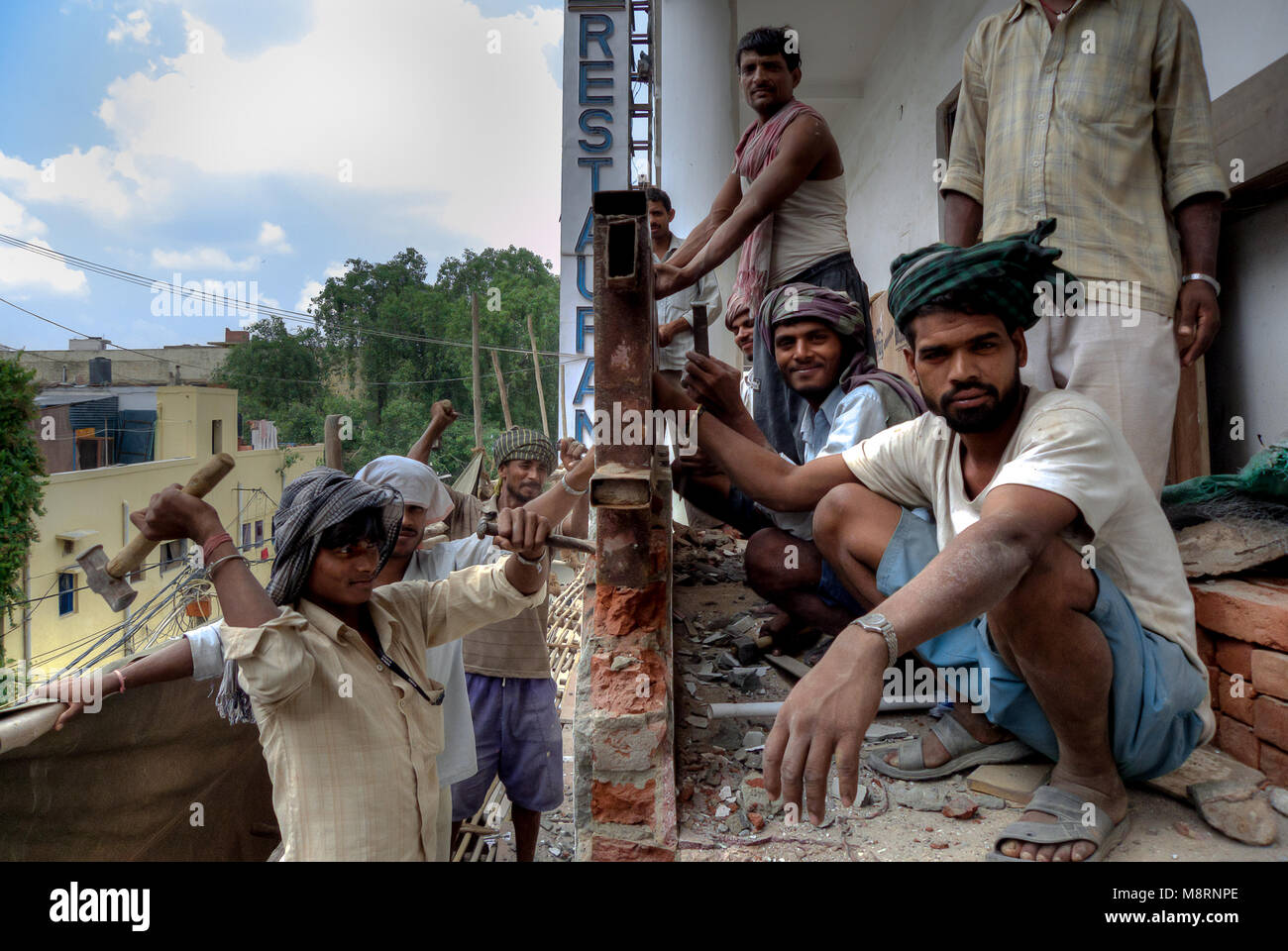 New Delhi, India: a team of bricklayers working on the renovation of a building in New Delhi Stock Photo