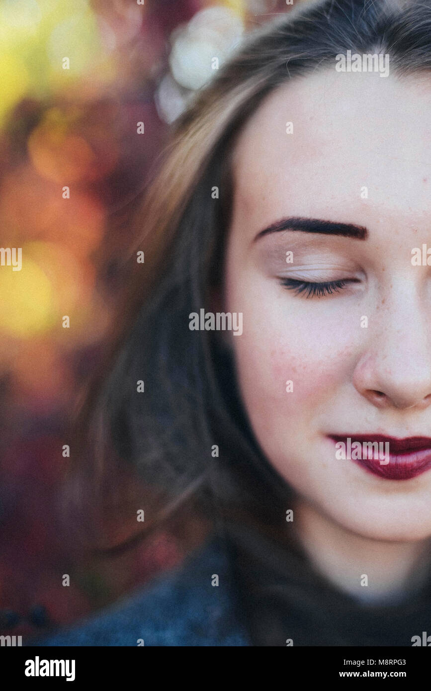Cropped image of woman with eyes closed at park Stock Photo - Alamy
