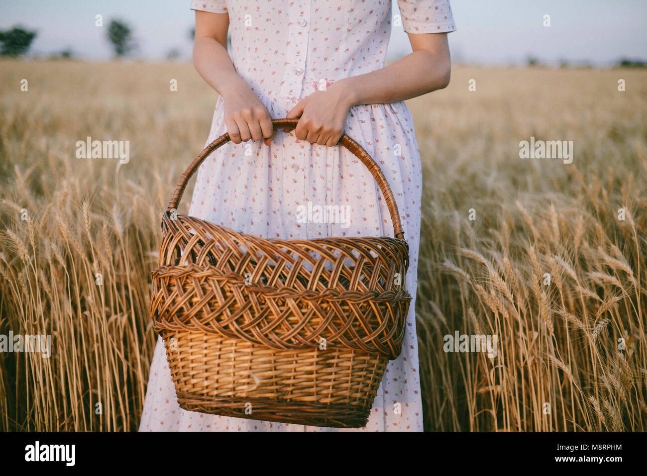 Young woman wicker basket hi-res stock photography and images - Alamy