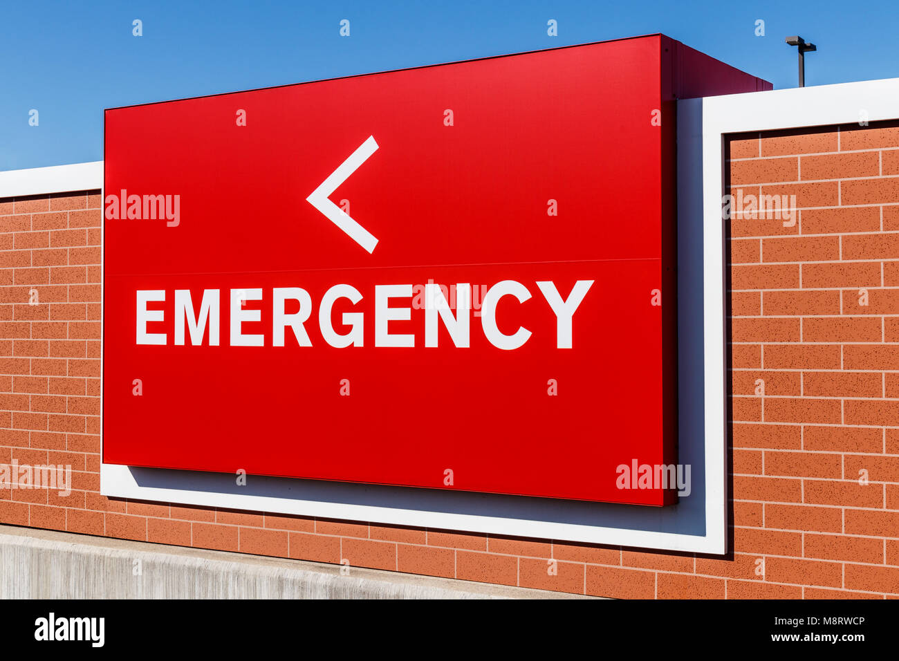 Red Emergency Entrance Sign for a Local Hospital II Stock Photo