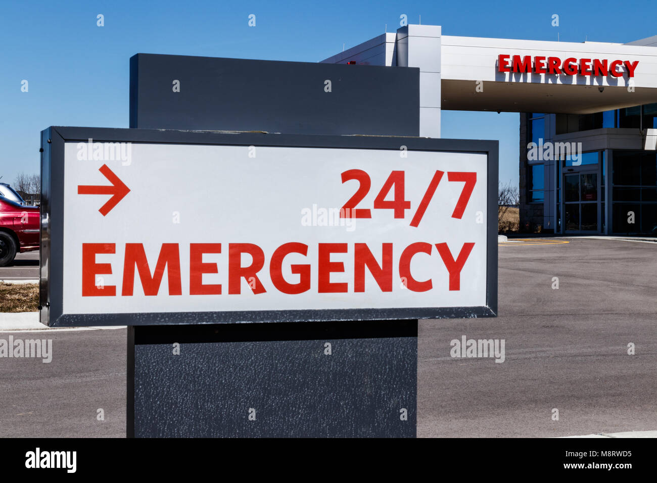 Red Emergency Entrance Sign for a Local Hospital III Stock Photo