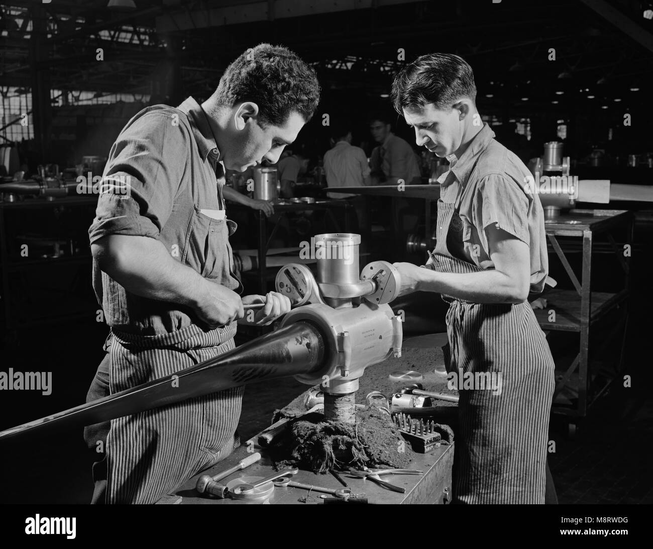 Leo Diana and George O'Meara working Assembling Propeller Blade for Military Aircraft at Manufacturing Plant, Hartford, Connecticut, USA, Andreas Feininger for Office of War Information, June 1942 Stock Photo