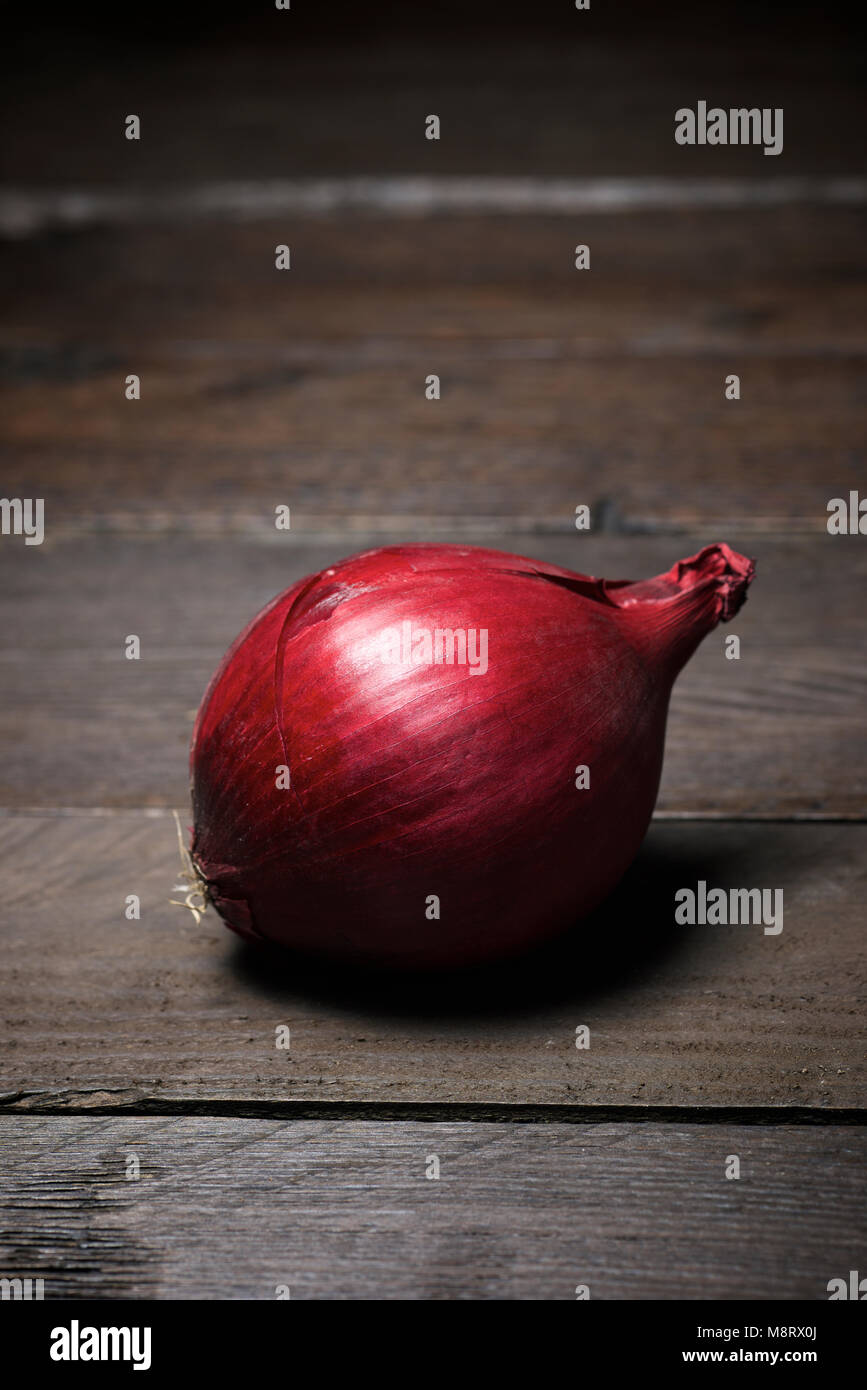High angle view of onion on wooden table Stock Photo - Alamy