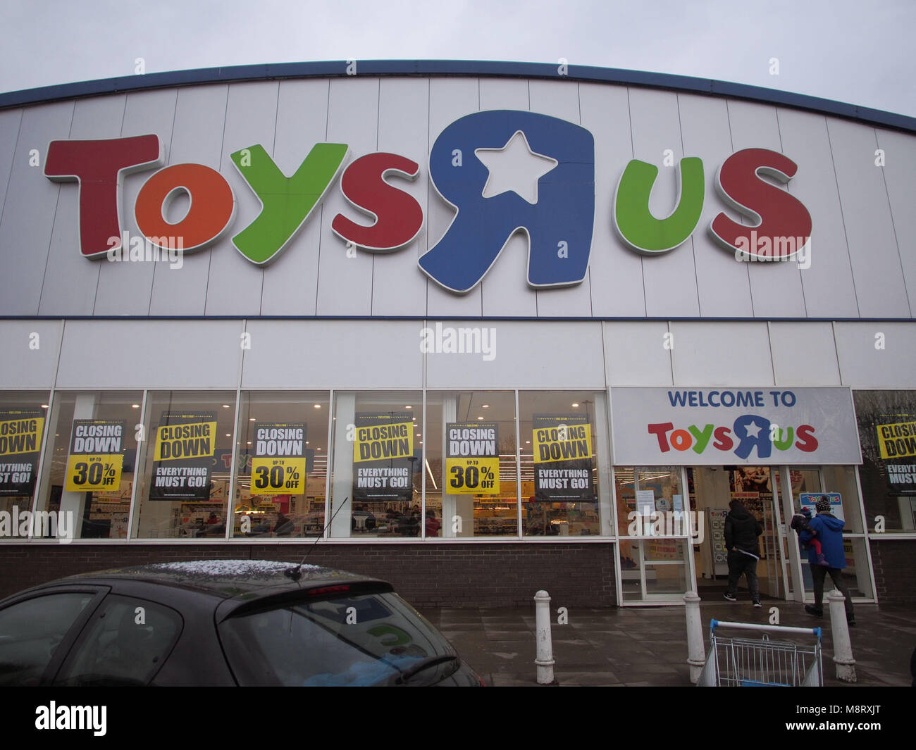 A Toys R Us store adorned with closing down signs after the retailer