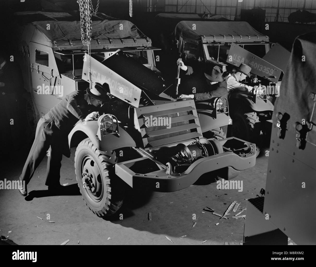 Army's Half-Track Scout Cars Being Inspected before Delivery from Factory Converted to War Production, White Motor Company, Cleveland, Ohio, USA, Alfred T. Palmer for Office of War Information, December 1941 Stock Photo